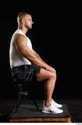 Whole Body Man White Sports Shorts Muscular Sitting Top Studio photo references